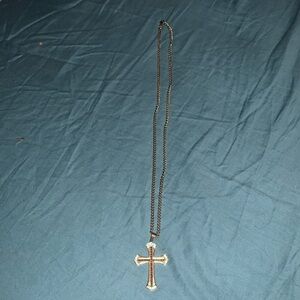 I am selling a gold cross necklace